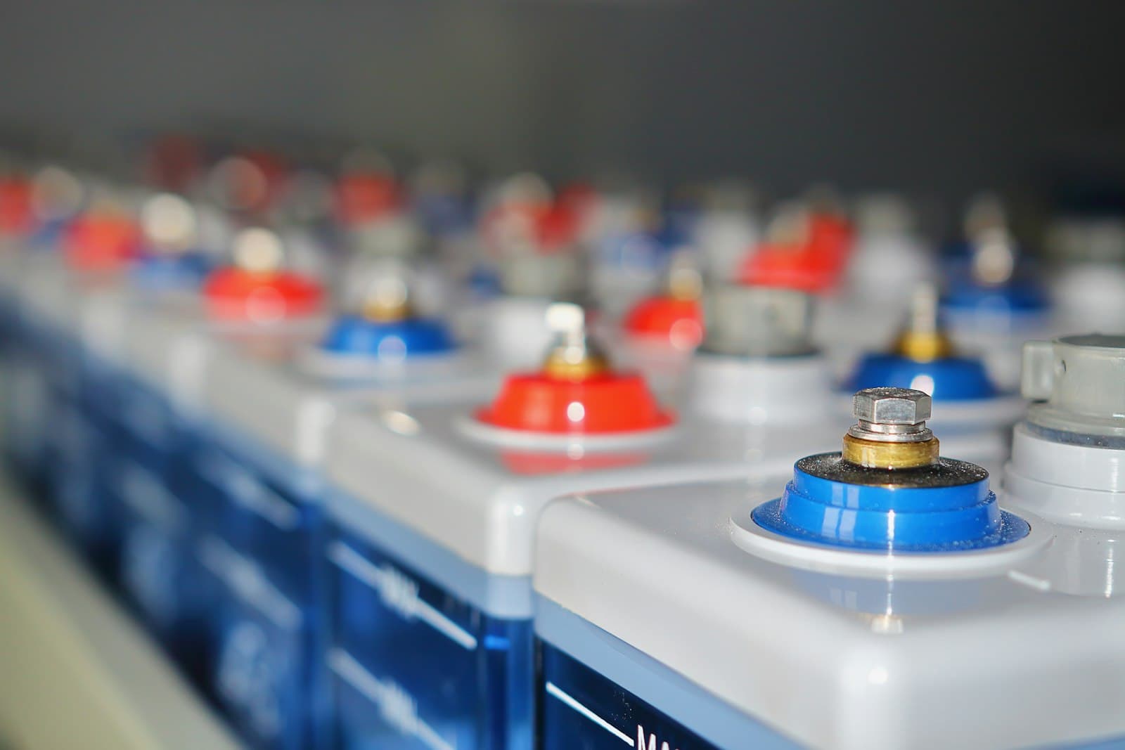 Close-up of battery terminals in a workshop